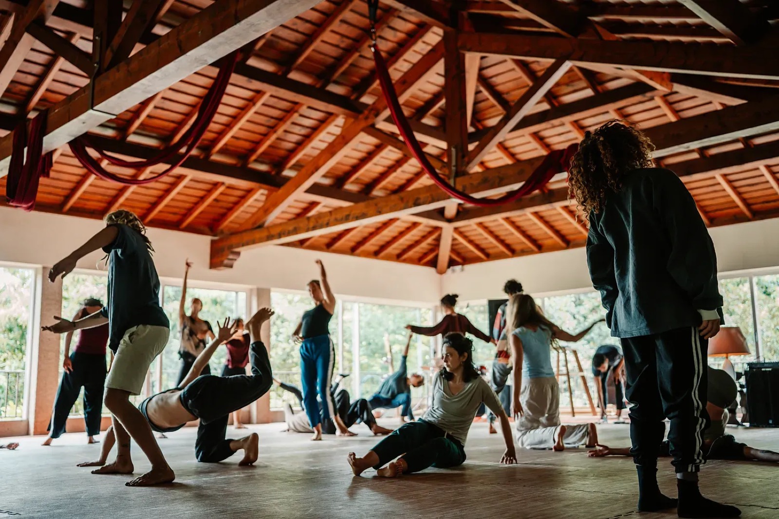 people moving in the big wooden dance hall
